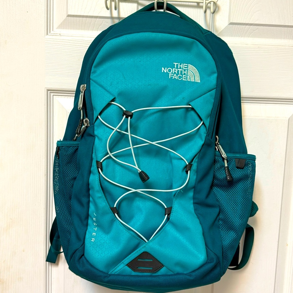 North face jester teal colored laptop bag.